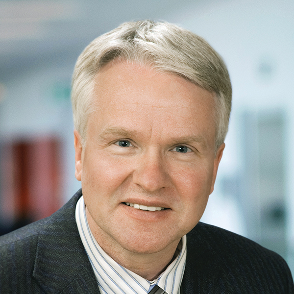 Tim Outhit professional headshot, smiling to camera