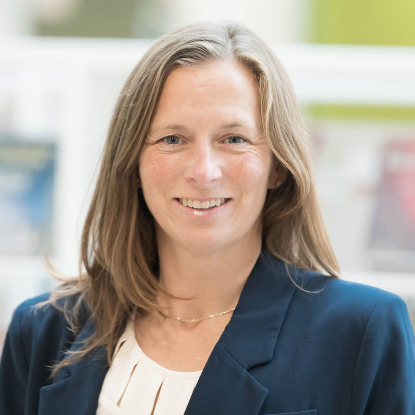 Jan Jensen professional headshot, smiling to camera