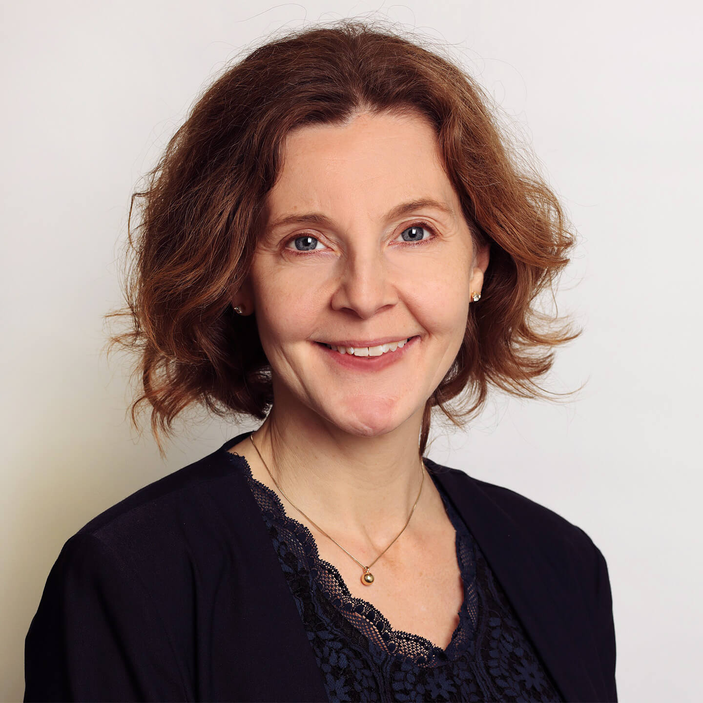 Laura White professional headshot, smiling to camera