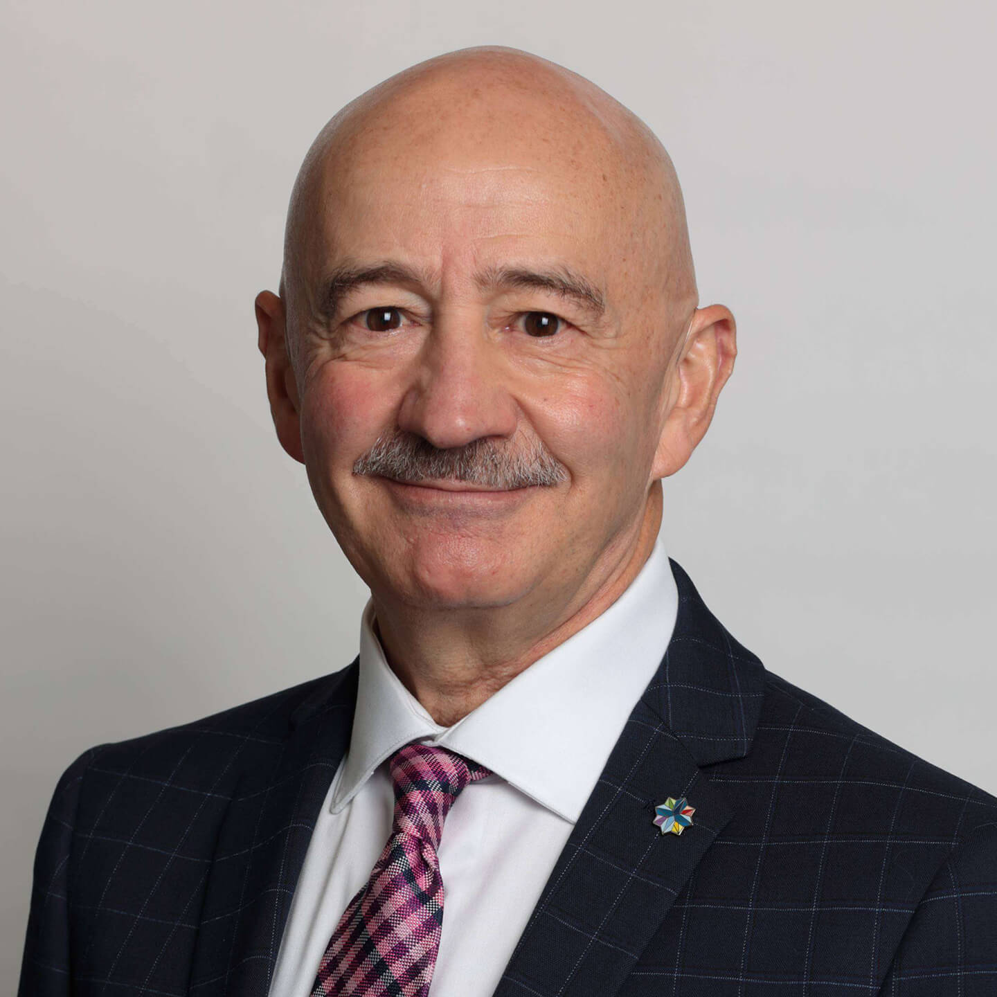 Tony Mancini professional headshot, smiling to camera